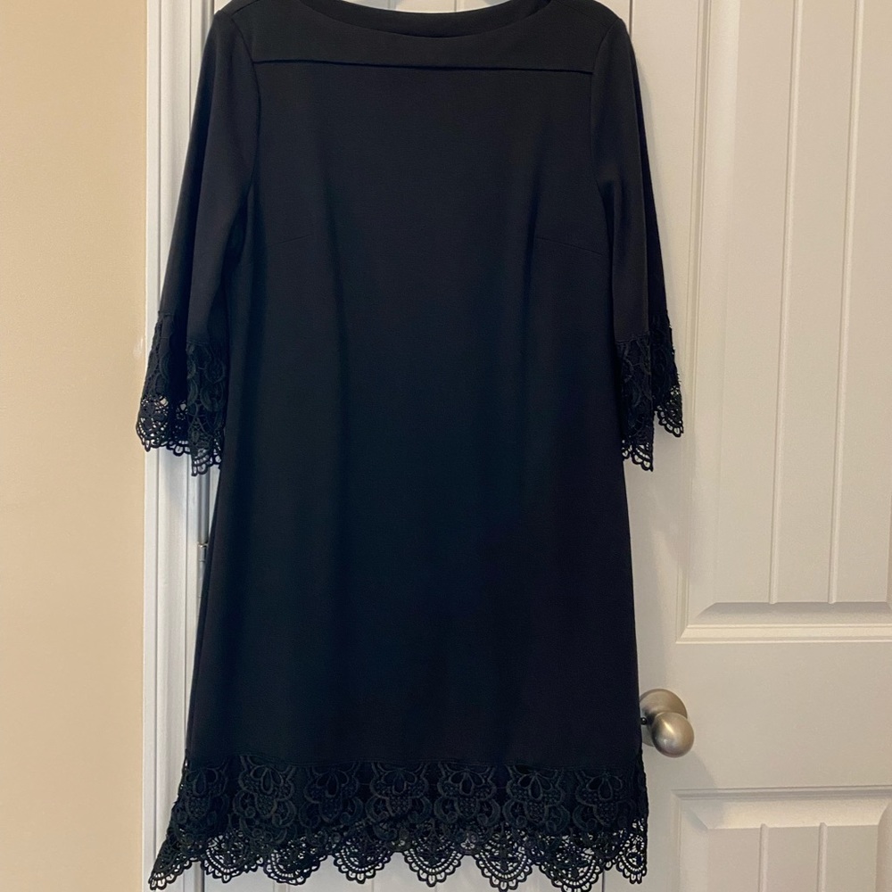 Black stretch dress with lace trim on sleeves and hem